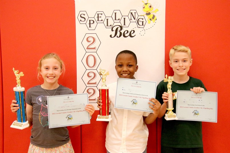 GIRL AND 2 BOYS HOLDING TROPHIES AND CERT